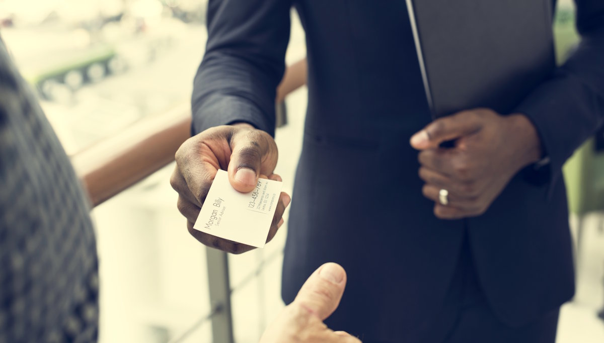 handing over business card