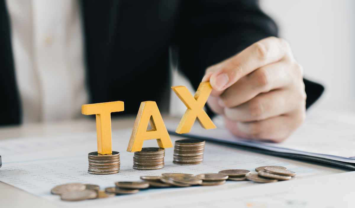 tax with coins and letters
