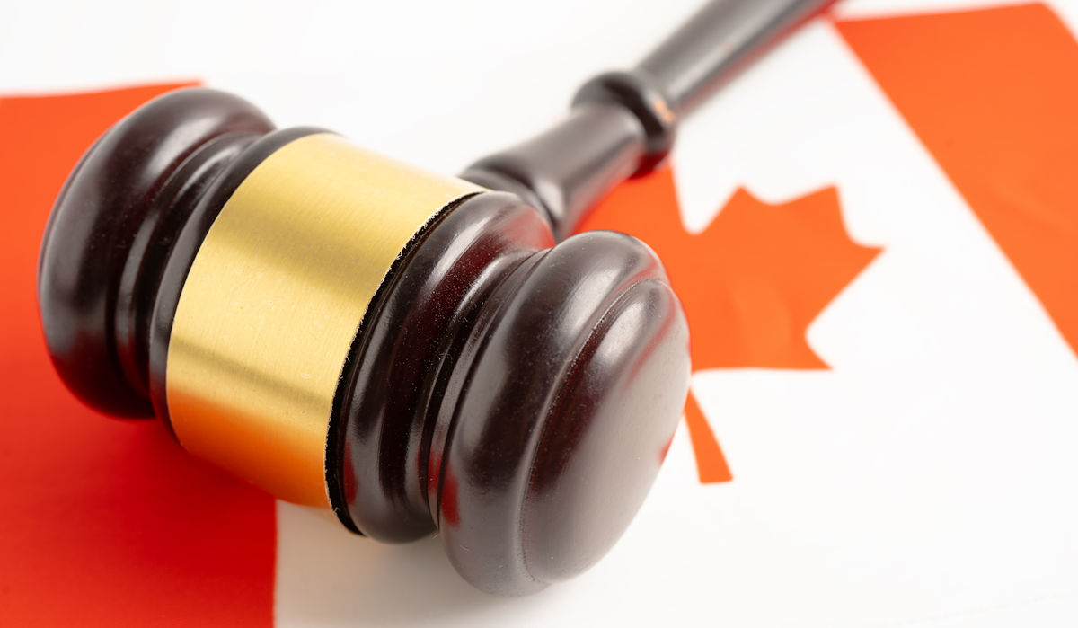 judge hammer on Canadian flag