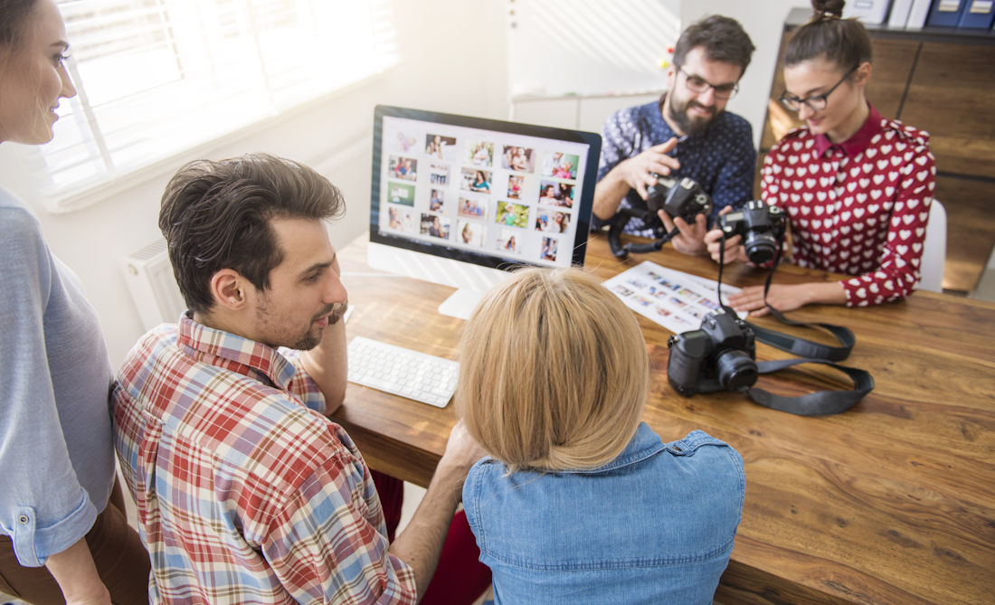 reviewing digital content with photographer 